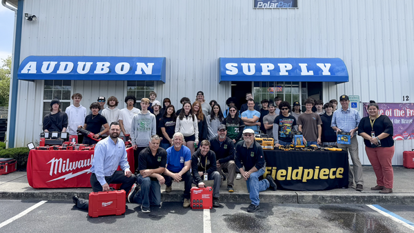 Cape Tech HVAC students and instructors, Audubon Supply representatives, as well as representatives from Rich-Tomkins Company and Tech Air Solutions holding donated tools  which will be used for the district’s HVAC program.
