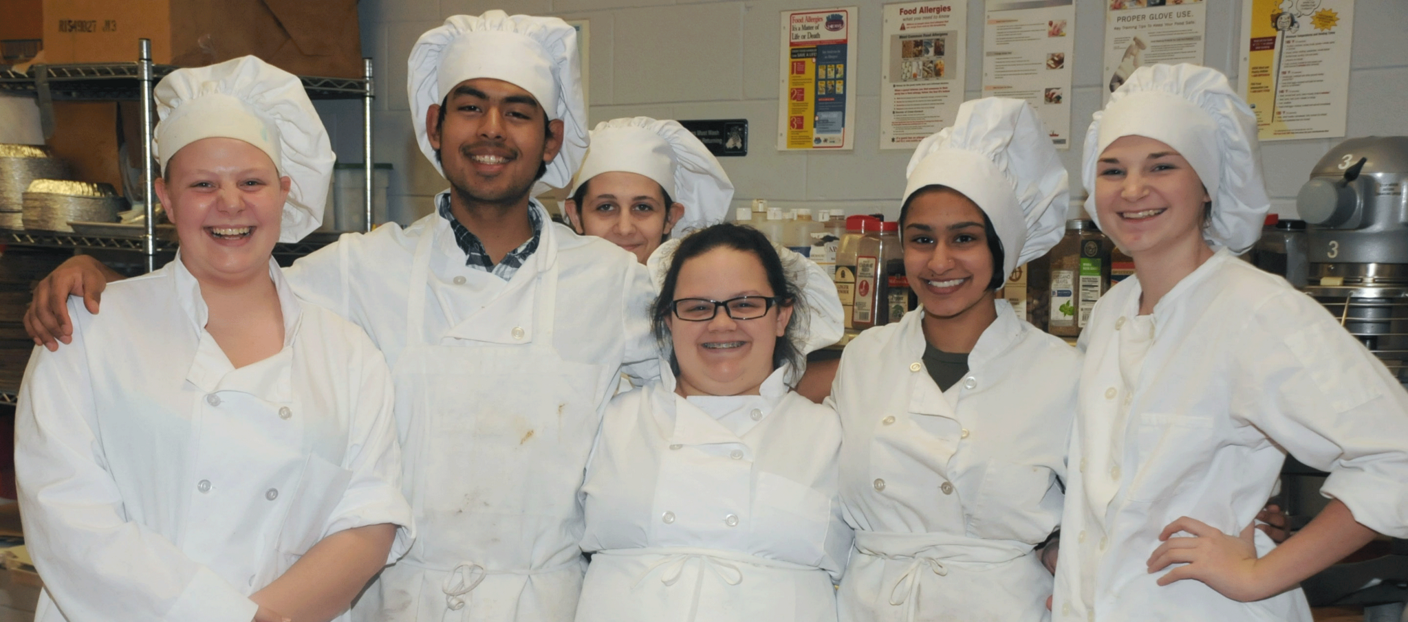 Group Image of six students from the Culinary Arts Program posing in uniform.